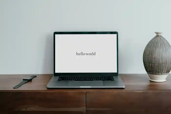 A laptop showing ‘hello world’